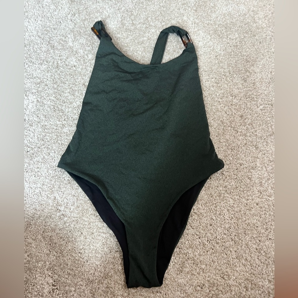 Tavik one piece cheeky swimsuit. Hunter green with brown detail buckles.